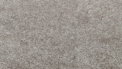 Subtle Texture of a Luxurious Grey Carpet Exhibiting Softness and Warmth