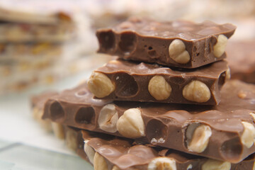 Delicious chocolate nougat with hazelnuts stacked on display