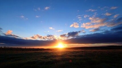 Obraz premium Breathtaking Sunrise over A Quiet Open Field with Clouds and Vibrant Colors : Generative AI