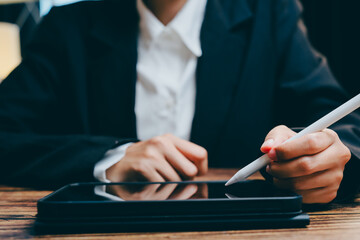 Professional Business Person Working on Digital Tablet with Stylus, business concept