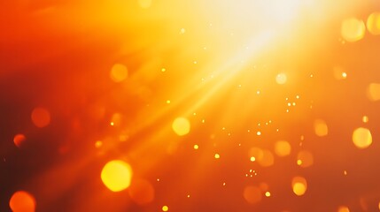 Abstract orange bokeh background with bright light rays.