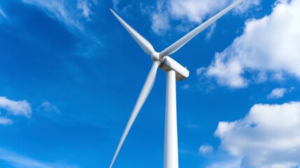 Fototapeta premium White wind turbine against a vibrant blue sky dotted with fluffy white clouds. Clean energy, sustainable power, renewable resource