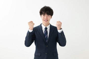ガッツポーズをするビジネスマン