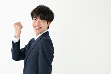 ガッツポーズをするビジネスマン