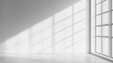 Sunlight Streams Through Large Windows, Illuminating a Minimalistic Indoor Space With Soft Shadows in Early Morning Light