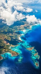 Aerial View of a Tropical Coastline Featuring Vibrant Blue Waters and Lush Green Hills Under a Partly Cloudy Sky