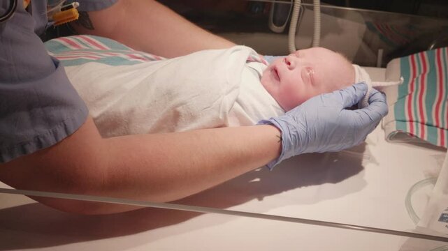 Putting a Night Cap on a Newborn