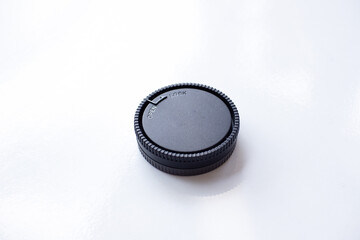 Camera lens cap isolated on white background