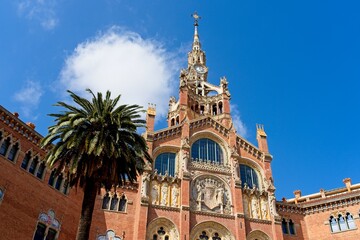 Fototapeta premium Barcelona Spain - 21 April 2024 - Street view of facade of Recinte Modernista de Sant Pau (Hospital de Sant Pau) in Barcelona