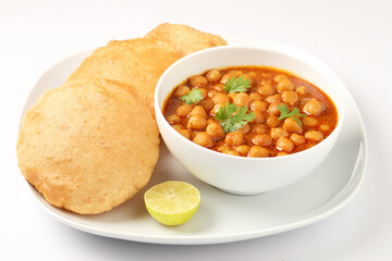 Famous Indian Dish Chole Puri in a white ceramic cutlery on white background 