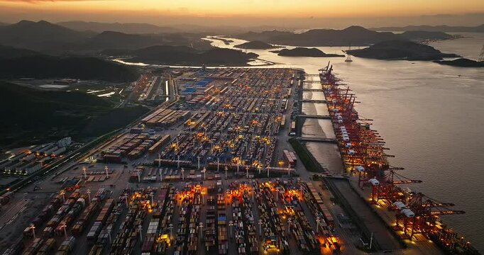 Aerial view of a busy container port at dusk in Ningbo, China.