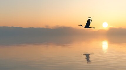 Fototapeta premium Ethereal image of a celestial crane with paper cut wings gracefully soaring over a tranquil lake its reflection mirrored in the calm waters as the sun rises in the distance