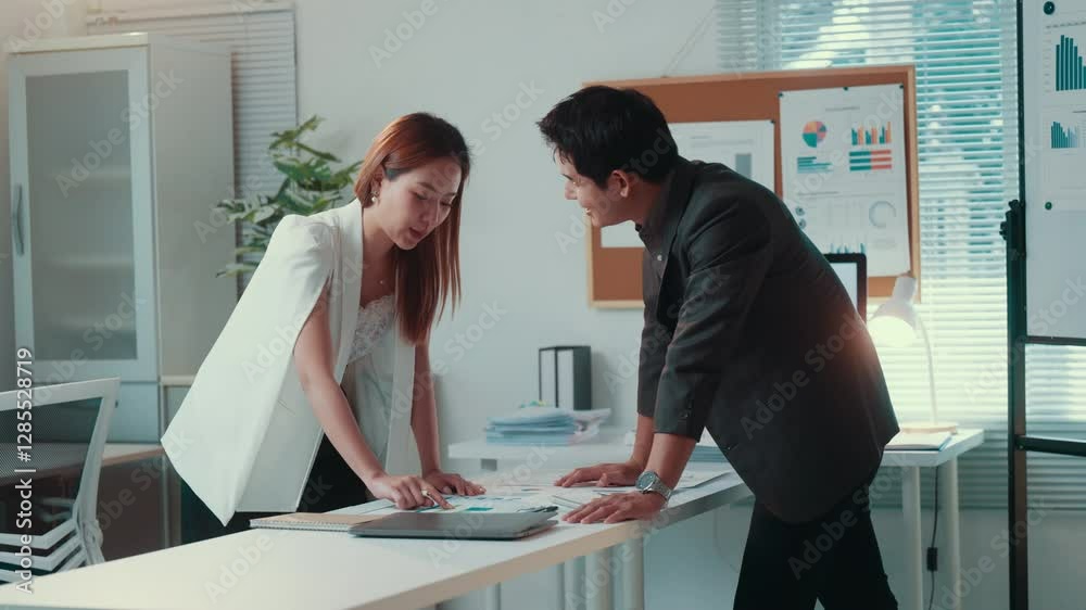 Aufkleber business colleagues reviewing reports, sharing insights, analyzing financial data while working toge