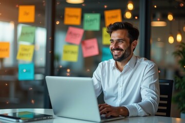 Home Office Setup. Smiling businessman with laptop working creative of