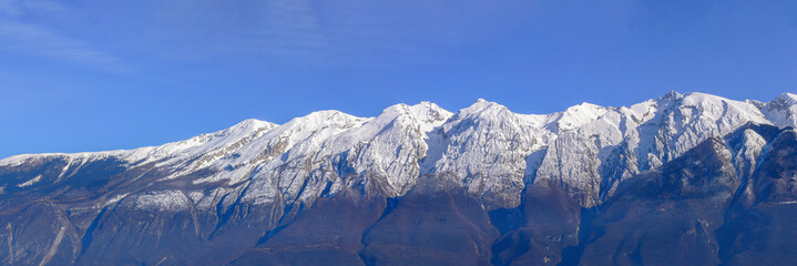 Panorama of the snow-covered Monte Baldo. The peak in the center of the picture is Cima Valdritta...