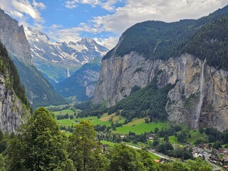 A stunning summer photo of Brienzer Rothorn, one of Switzerland’s most beautiful peaks, showcasing its majestic view over the surrounding Swiss Alps. The image captures the lush green landscapes and v