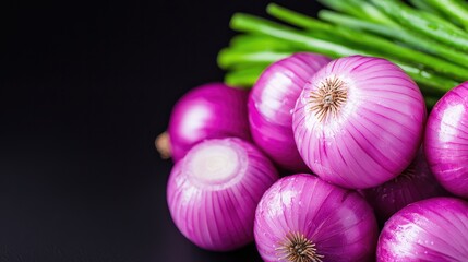 Fresh red onions and scallions on dark background, food photography for recipe blogs