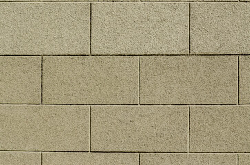 plastered cinder block wall painted light green