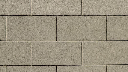 plastered cinder block wall painted light green