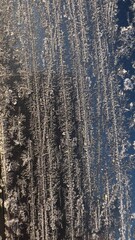 Obraz premium frost on the window against the sky