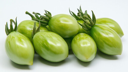 Branch of green tomatoes. Branch of green unripe cherry tomatoes.