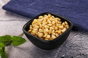 Peeled cedar nut in the bowl
