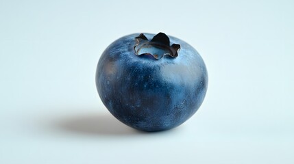 Obraz premium A single blueberry, isolated on a white surface
