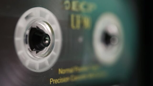 The tape recorder plays an audio cassette. A vintage cassette from the 1990s.