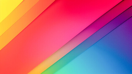 Obraz premium The image shows a vibrant gradient of colors transitioning smoothly from yellow to red, pink, purple, and blue, creating a visually appealing and dynamic abstract background.