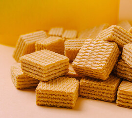 Crunchy wafers stacked in a colorful background for treat lovers