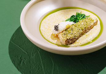 Exquisite culinary presentation with fish and vibrant garnish