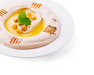 Creamy hummus topped with chickpeas and drizzled with olive oil