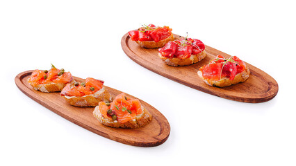 Gourmet tapas with smoked salmon and vibrant tomato toppings