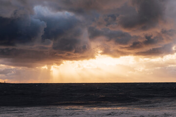 Beautiful landscape stormy sea and sky at sunset with clouds