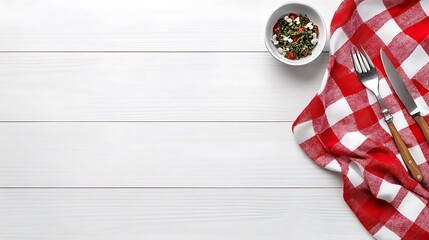 Obraz premium Red Gingham Napkin, Cutlery, and Small Bowl on White Wood Table AI Generated