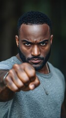 A Man Showing A Fist Toward The Camera