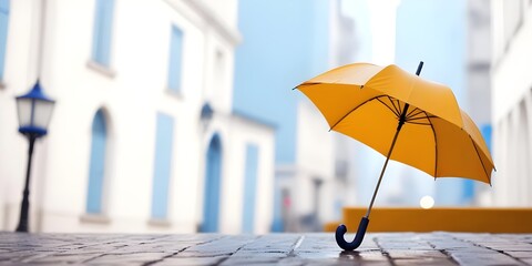 A umbrella on a city street with a blurred background