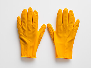 Obraz premium Pair of yellow rubber cleaning gloves on a white background