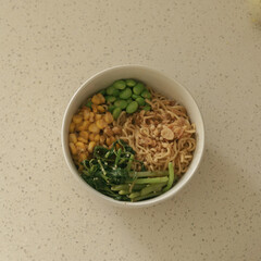 bowl of instant noodle with greens