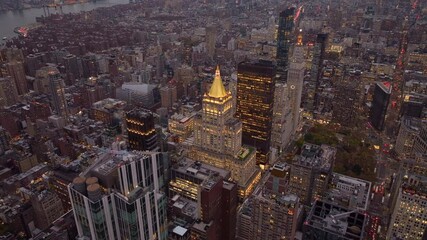 Aerial nightscape capturing New York Life Building in Rose Hill and NoMad neighborhoods of Manhattan towering New York skyscrapers - Powered by Adobe