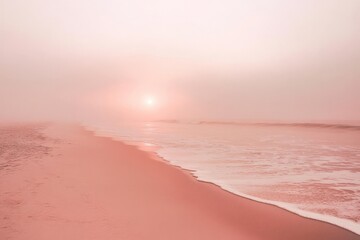Obraz premium Serene sunrise over misty pink beach with gentle waves