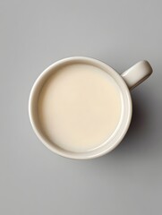 Minimalist Cup of Creamy Milk on Gray Background with Details