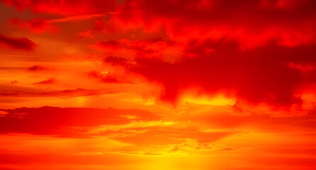 Fototapeta premium Dramatic fiery sunset red orange yellow gold abstract background. Warm glow. Burning flame energy. Vivid gradient