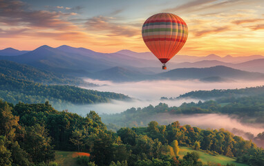 Naklejka premium A vibrant hot air balloon soaring above lush green mountains at sunrise.