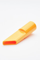 Yellow Plastic Nozzle Attachment on a White Background for Cleaning Equipment..