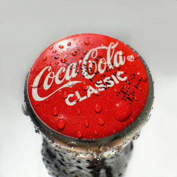 Coca Cola classic bottle and cap close up