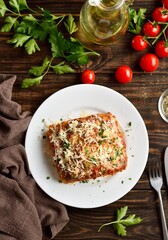 Lasagna with ground beef, ricotta cheese and tomato sauce