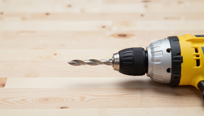 DIY Home Renovation close-up of cordless power drill on light wooden surface for home improvement blogs and presentations