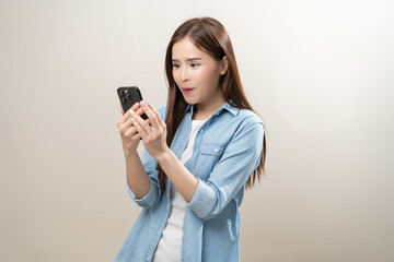 Naklejka premium Happy with phone asian young woman, girl holding mobile smart phone, read good news winning feel excited getting offer, great positive surprise, celebrate success on smartphone isolated on background.