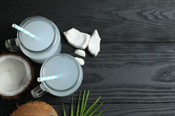 Mason jars of coconut water with nuts on the table